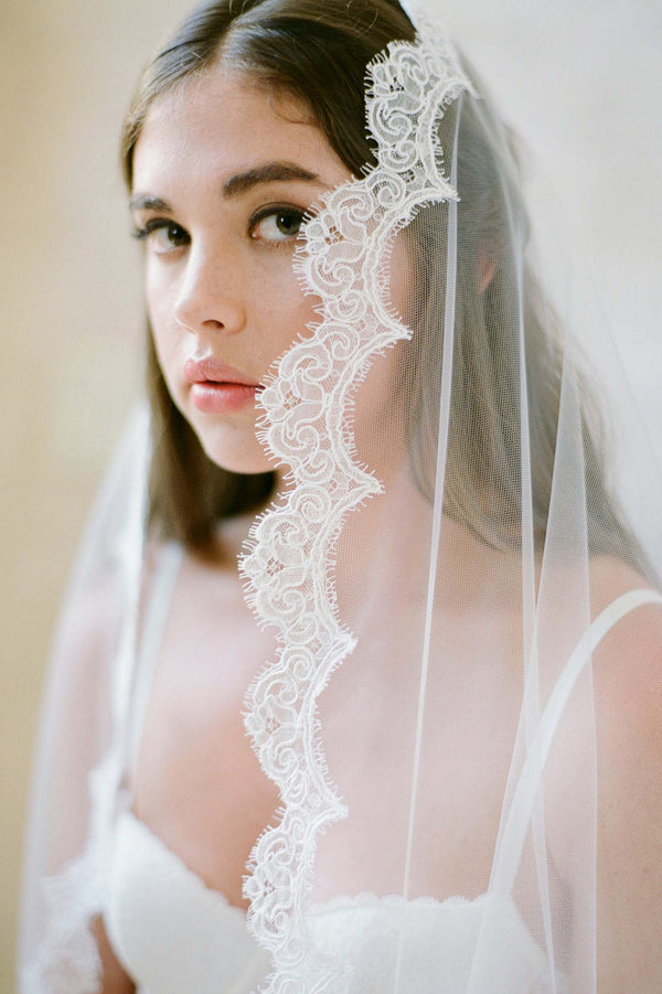 https://www.girlandaseriousdream.com/cdn/shop/products/Sophie_french_scallop_lace_mantilla_cathedral_veil_ivory_jose_villa_boudoir_bride_600x.jpg?v=1573848598